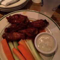 Kentucky Bourbon Wings · Cooked wing of a chicken coated in sauce or seasoning.