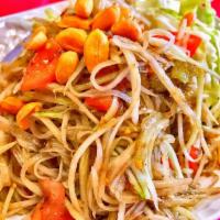 Green Papaya Salad · Lao or Thai style green papaya, tossed with tomatoes, crushed peanuts and side of cabbage.