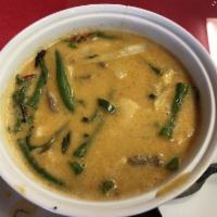 Red Curry · Coconut milk based curry with red sauce, bell peppers, green beans, bamboo, and carrots.