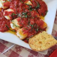 Manicotti · Tubular pasta stuffed with ricotta cheese, hearty tomato sauce and mozzarella cheese. Add Al...