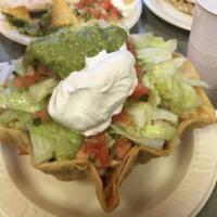 Tostada Salad · Large  flour tortilla  bowl filled with your choice of meat, rice, beans lettuce, guacamole,...
