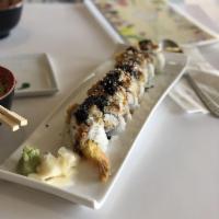 Dragon Roll · Shrimp tempura, crab meat & cucumber topped with eel, avocado, tobiko, & eel sauce.