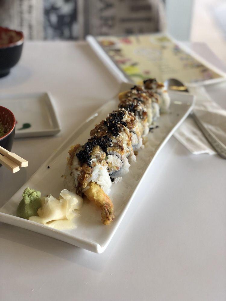 Dragon Roll · Shrimp tempura, crab meat & cucumber topped with eel, avocado, tobiko, & eel sauce.