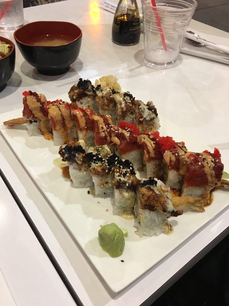 Black Dragon Roll · Shrimp tempura, crab meat & cucumber topped with deep-fried eel, tobiko, eel sauce & wasabi mayo.