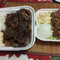 Kalua Pork with Cabbage Bowl · Served with rice and steamed vegetables.