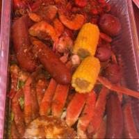 La Cajun Super Boil · 2 lbs crawfish, 12 shrimp, 2 lbs snow crab with corn, potatoes, and sausage link.