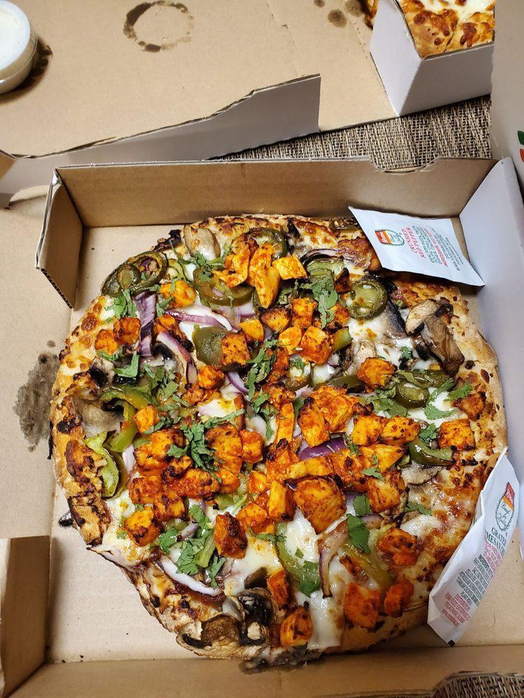 Chicken Tikka Pizza · Red sauce, mozzarella cheese, bell pepper, mushrooms, red onions, cilantro and grilled chicken.