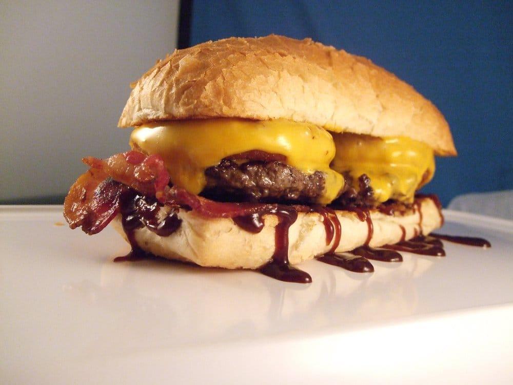 Western Burger · Served with only BBQ sauce, bacon, onion rings and cheese on Brioche Bun