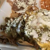 Chilaquiles · The truth of the Mexican platter, fried corn tortilla cooked with salsa, with queso fresco, ...