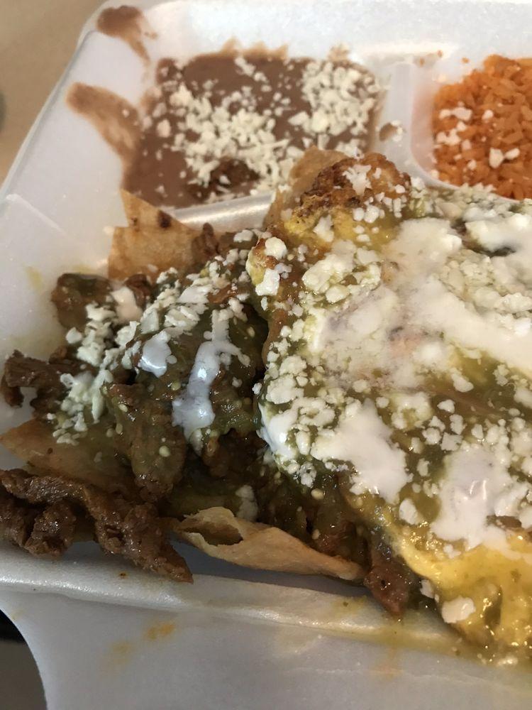 Chilaquiles · The truth of the Mexican platter, fried corn tortilla cooked with salsa, with queso fresco, sour cream on top, rice, and beans.