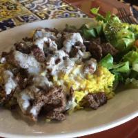 Beef Shawarma Plate · Turmeric rice topped with grilled beef shawarma and tahini sauce, served with house salad. G...