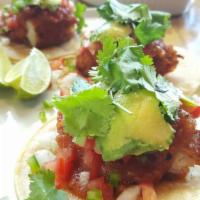 Fish Tacos · Fried wild caught cod, avocado, onion, tomato, jalapeno, salsa, cilantro, soft tacos.