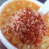 Elote · Mexican white corn prepared with butter, mayonnaise, chili powder, lime and  powdered cheese.