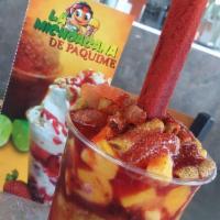Chamomix · 16oz clear cup wit your choice of mango or lime ice cream, covered with chamoy, mango pieces...