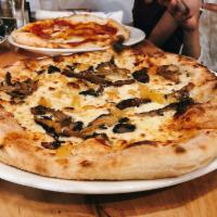 Funghi Pizza · Garlic confit, foraged mushrooms, pecorino crema, preserved lemon, and oregano.