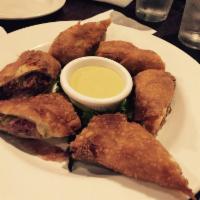 Dublin Rolls · Pulled corned beef, braised cabbage and vegetables wrapped in egg roll skins Guinness mustar...