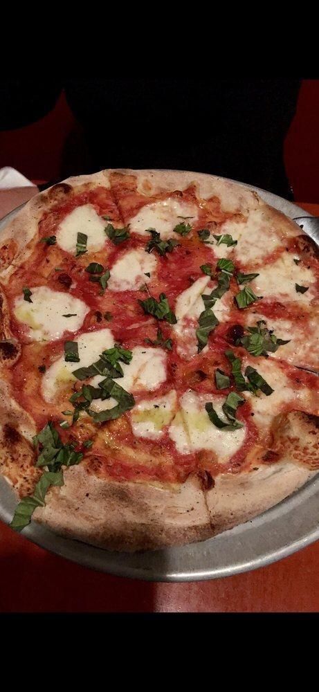 Margherita Pizza · Tomato sauce, Buffalo mozzarella, fresh basil.