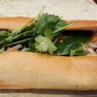 Grilled Pork Sandwich · Foot long sandwich cut in half served with pickled carrot, daikon, radish, cucumber, cilantr...