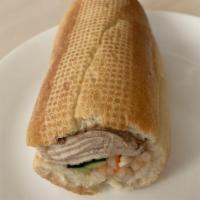 Steamed Pork Sandwich · Foot long sandwich cut in half served with pickled carrot, daikon, radish, cucumber, cilantr...