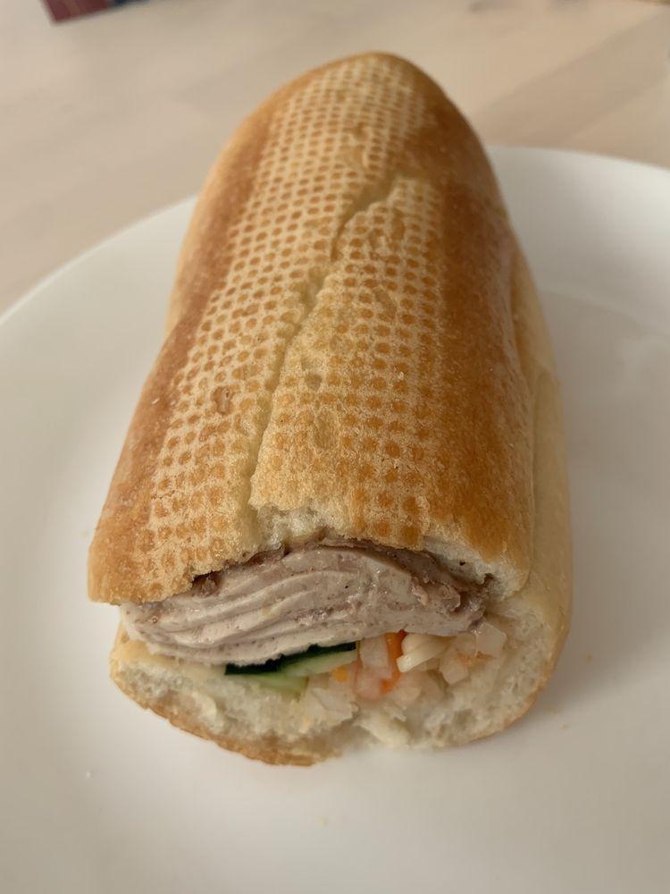 Steamed Pork Sandwich · Foot long sandwich cut in half served with pickled carrot, daikon, radish, cucumber, cilantro, and jalapeno unless requested otherwise.