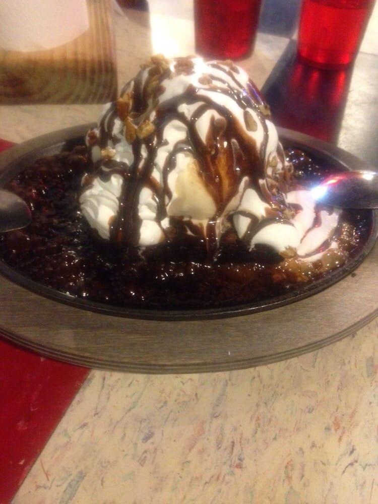 Willie Wonka · Triple chocolate brownie, topped with ice cream, whipped cream, chocolate sauce, and chopped pecans