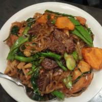Drunken Noodles · Stir-fried thin rice noodles with basil leaves, Chinese broccoli, snow peas, tomato, carrot ...