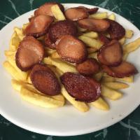 Salchipapa · French fries with fried slices of hot dog.