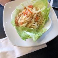 Som Tum Thai · Papaya salad. Shredded green papaya mixed with chili pepper, tomato, carrots, ground peanuts...