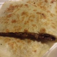 Carne Asada Quesadilla · Marinated steak strips seasoned and grilled, then placed in a flour tortilla with melted che...