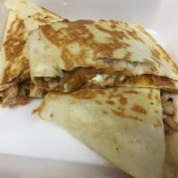 Chicken Quesadilla · Marinated chicken simmered in our own pico de gallo, placed in a flour tortilla with melted ...