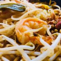 Pad Thai · Stir-fried rice noodle with egg, bean sprouts, green onions and tamarind sauce. Served with ...