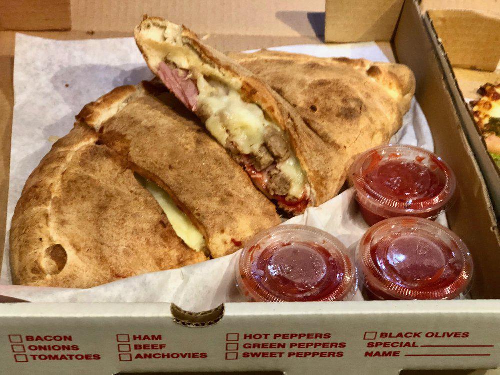 Meat Lovers Calzone · Beef, pepperoni, Italian sausage, Canadian bacon and mozzarella cheese.