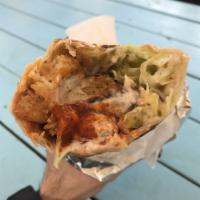 Chicken Shawarma Sandwich · Garlic sauce, lettuce, shredded cabbages, grilled onions, pickles, french fries and chicken ...