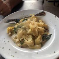 Tortellacci Carbonara · Cheese filled tortellacci, pancetta, spinach, garlic, Parmesan and heavy cream.