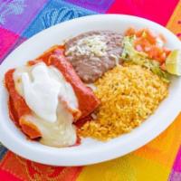 Enchiladas Dinner · Three enchiladas with red or green sauce, your choice of steak or chicken. Served with a sid...