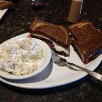 Corned Beef Sandwich · Our homemade corned beef, sliced thick and piled high, then topped with provolone cheese, an...