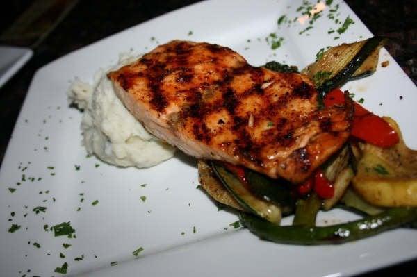 Jameson Whiskey Glazed Salmon · Fresh Alaskan salmon, marinated and grilled, then brushed with our Jameson whiskey glaze and served with grilled veggies and colcannon mashed potatoes.