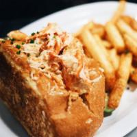 Lobster Grinder · Chilled lobster, shrimp, and spiced aioli packed into a split-top butter roll.