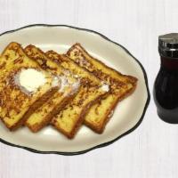 French Toast · Four pieces of our signature French toast with butter and syrup.