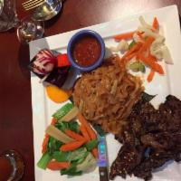 Thai Beef Steak · Chef's special sirloin marinated with spices served with pad Thai noodle or fried rice.