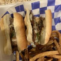 New York Cheese Steak · Beef strip steak, sauteed mushrooms, red onions and green peppers topped with provolone chee...