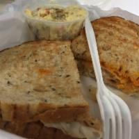Turkey Reuben · Thinly sliced turkey breast, sauerkraut and Swiss cheese served hot on toasted rye with Russ...