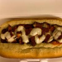 Hot Chick · Bacon wrapped beef dog with melted mozzarella cheese, a chopped chicken tender and topped wi...
