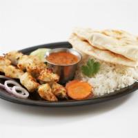 Chicken Tikka Kabobs · Chicken marinated in yogurt, spices, & herbs. Two kabobs, grilled peppers & red onions. Serv...