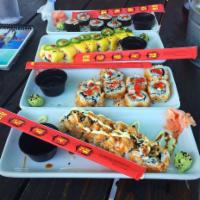 Spicy Tuna Roll · Fresh tuna mix rolled with carrots, cucumber and cream cheese. Served over wasabi cream and ...