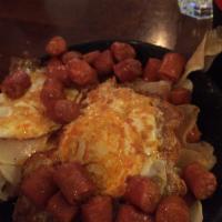 Huevos Rotos · Coming right from Spain, eggs fried with garlic and vinegar on top of your choice of Spanish...