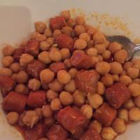 Garbanzos Con Chistorra · Chickpeas and red Spanish sausage sauteed in olive oil, subsequently flambeed with white wine.