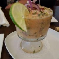 Ceviche · Fresh raw fish cured in citrus juices mixed with hot sauce, milk and spices, accompanied wit...