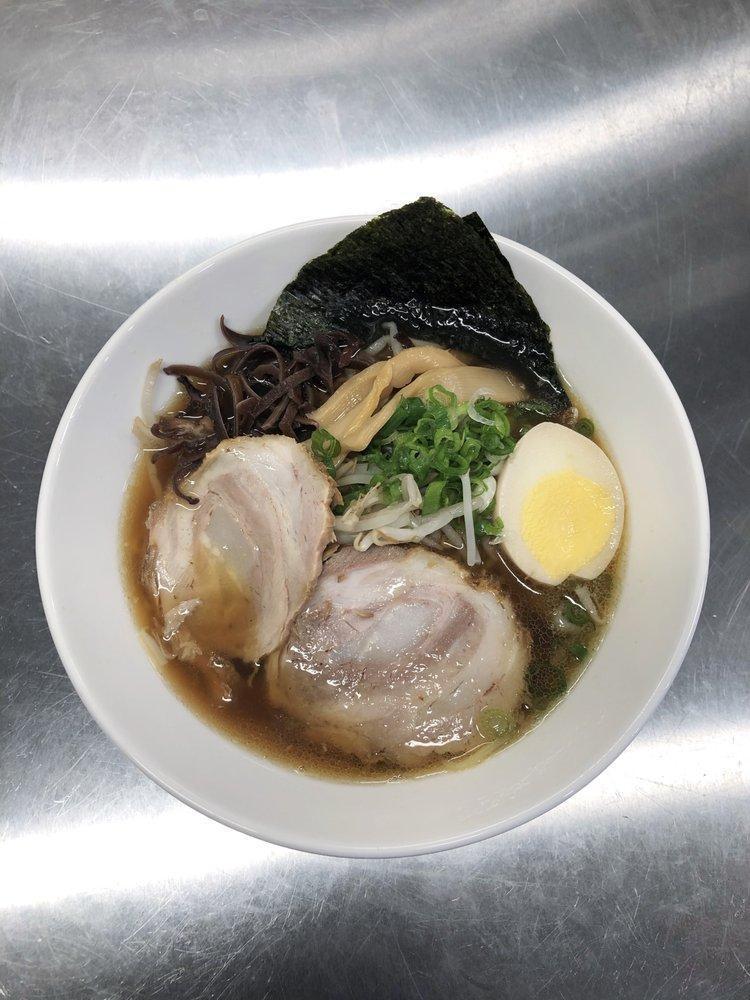 Shoyu Ramen · Soy sauces flavor. 2 slices of chashu pork, boiled egg, green onion, bean sprouts & wood ear mushrooms on top.
