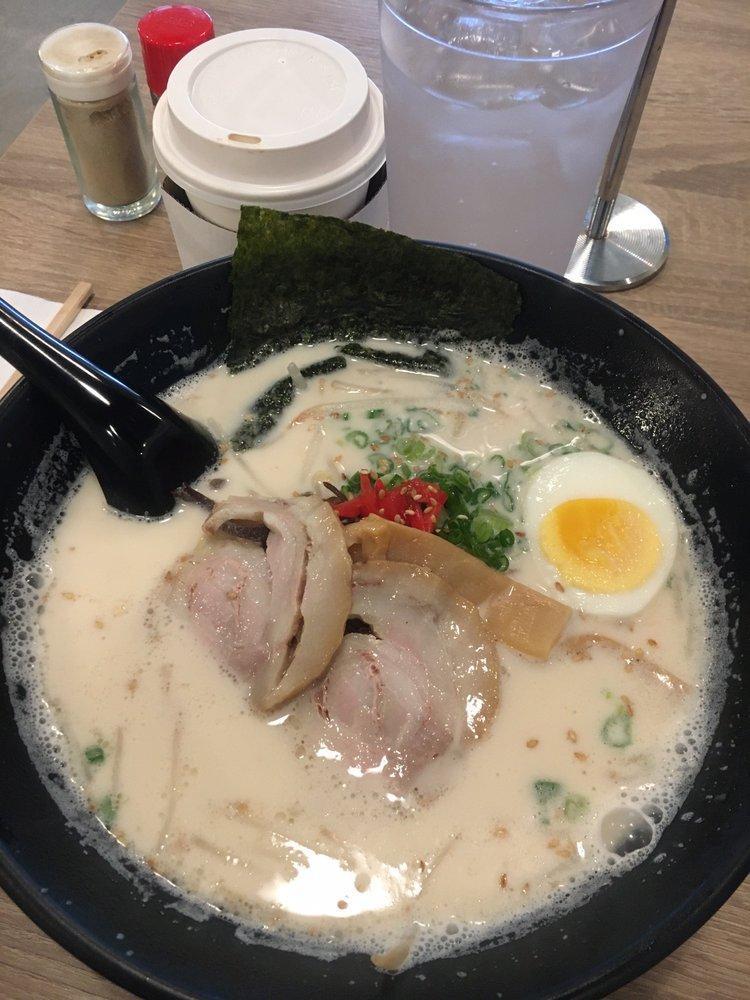 Tonkotsu Ramen · 2 slices of chashu pork, boiled egg, red ginger, green onion, bean sprouts and wood ear mushrooms on top
